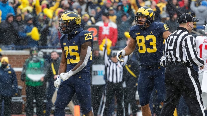 Michigan's Hassan Haskins celebrates a TD vs Ohio State